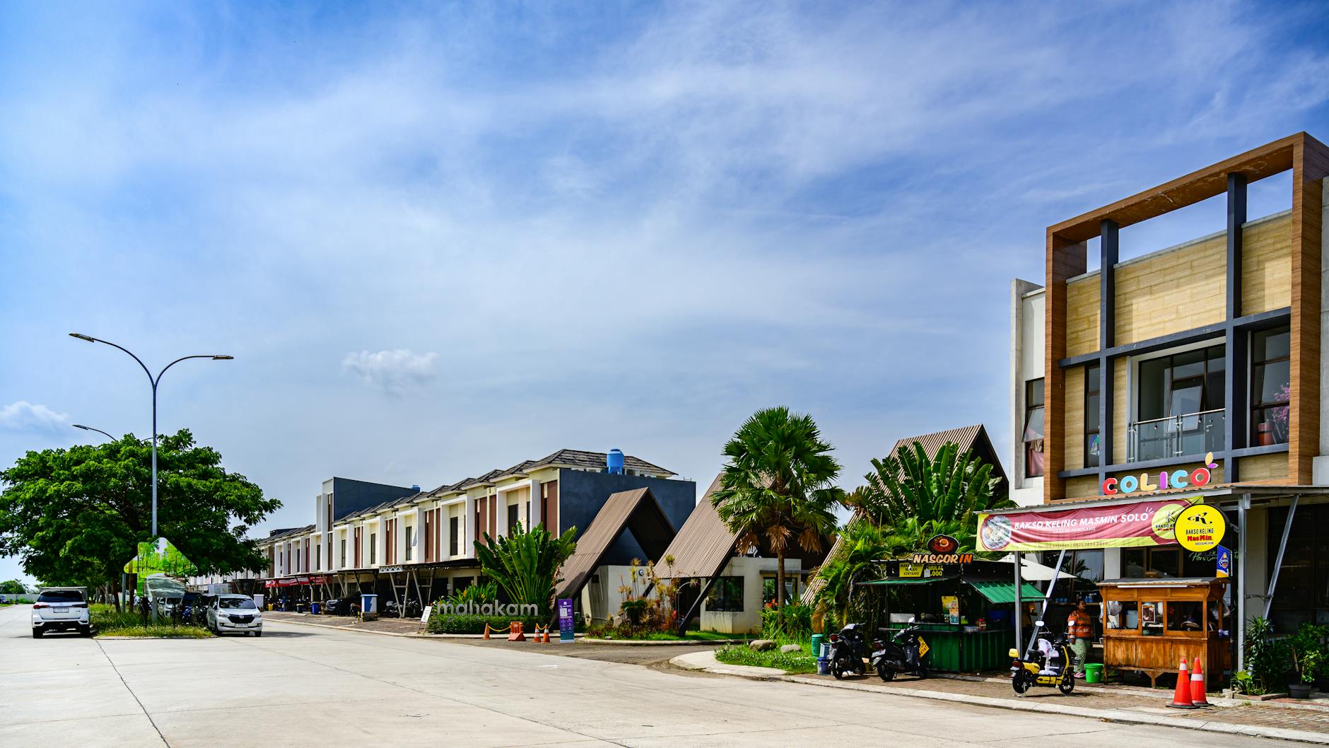 Sydney Road Brunswick streetscape with tram and shops