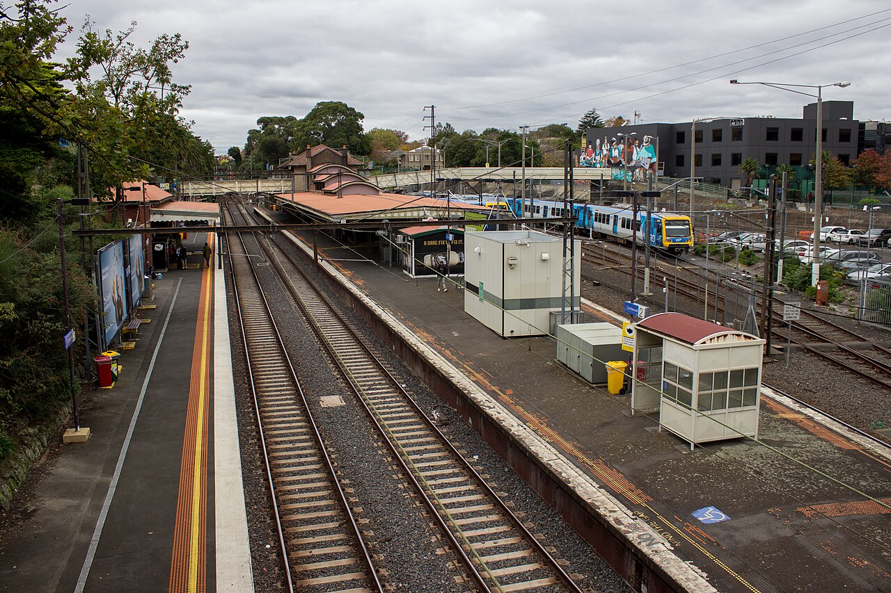 Camberwell railway station platforms and a Metro train seen from the Burke Road bridge, Melbourne