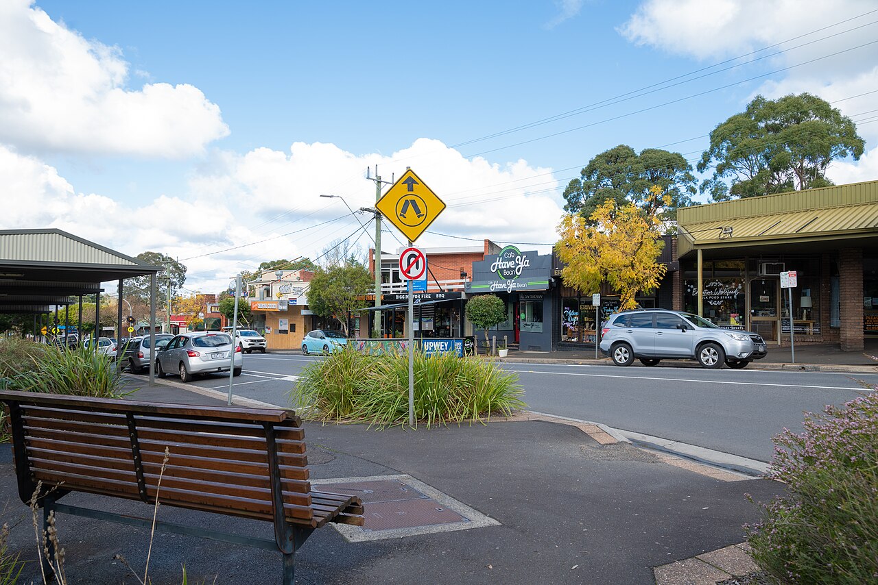 Upwey shops with a bench and garden bed