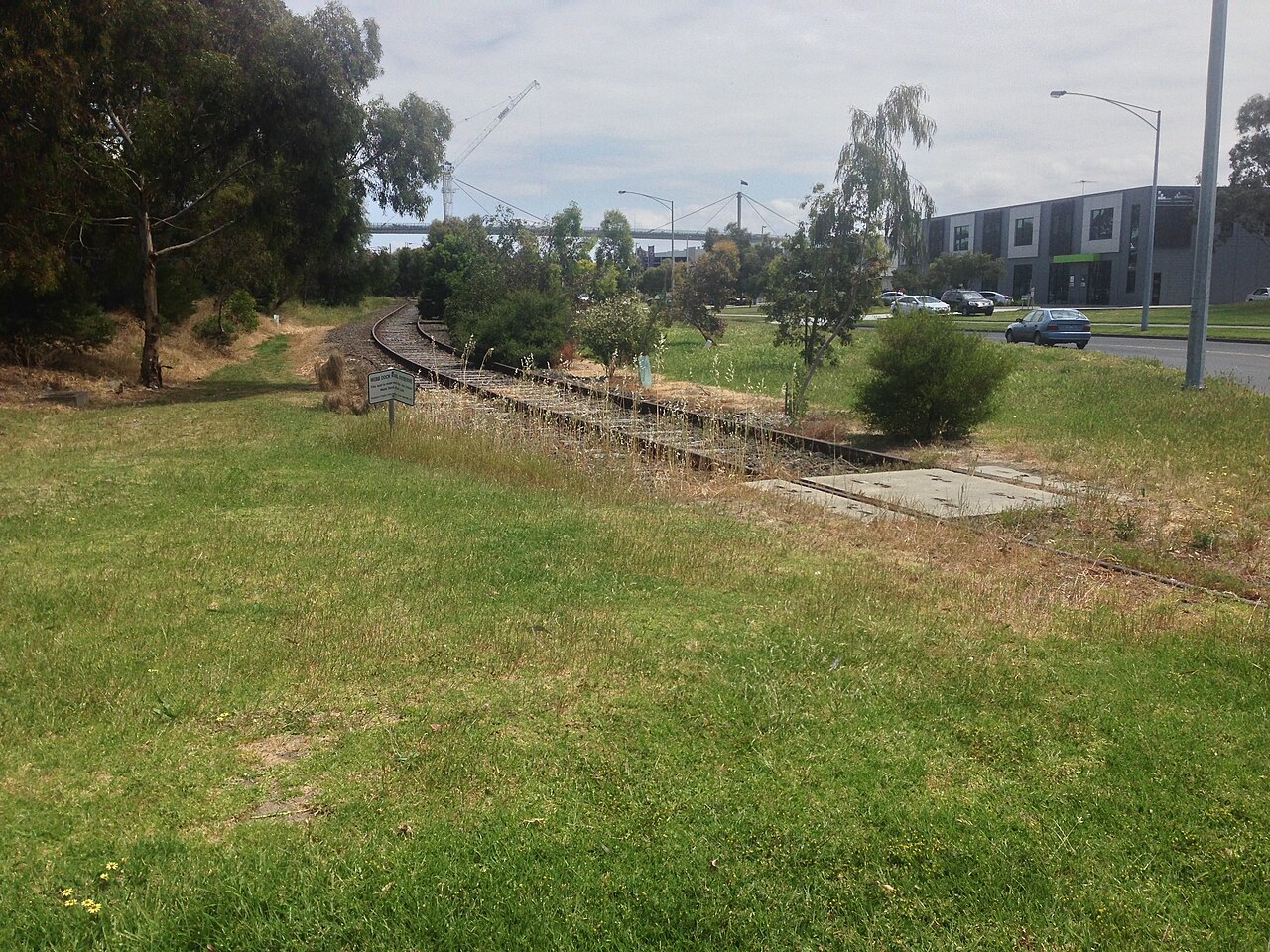 Grassy reserve along the abandoned Webb Dock rail line