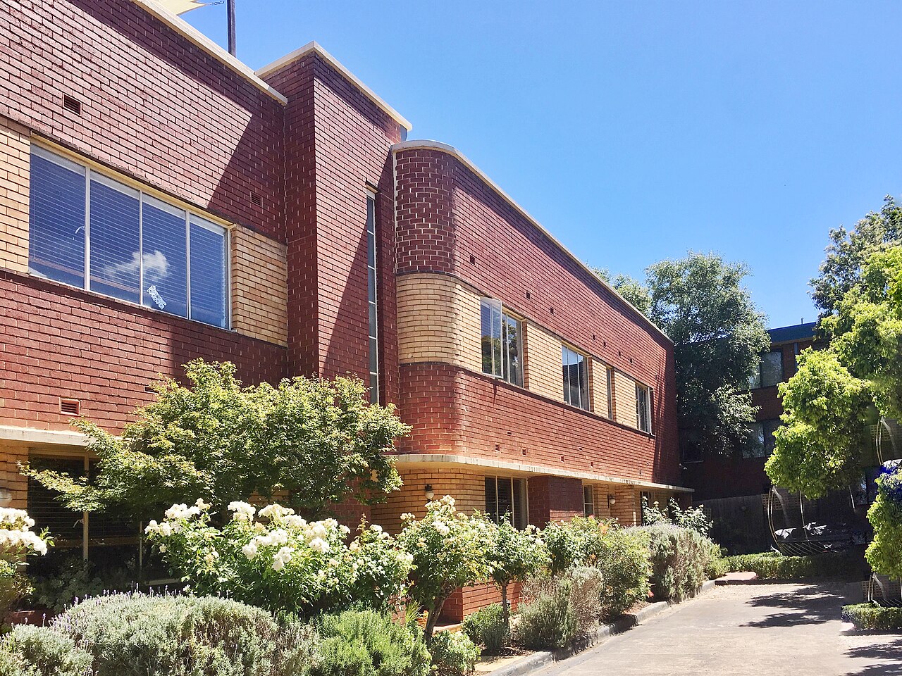 Brick Brunswick Fire Station Flats behind garden beds