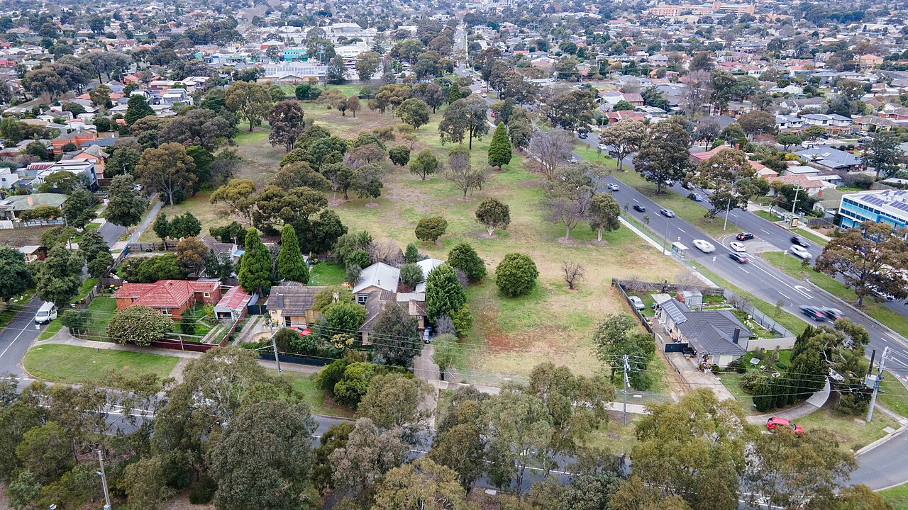 Aerial view of a former public housing site and surrounding streets on Bardia Avenue