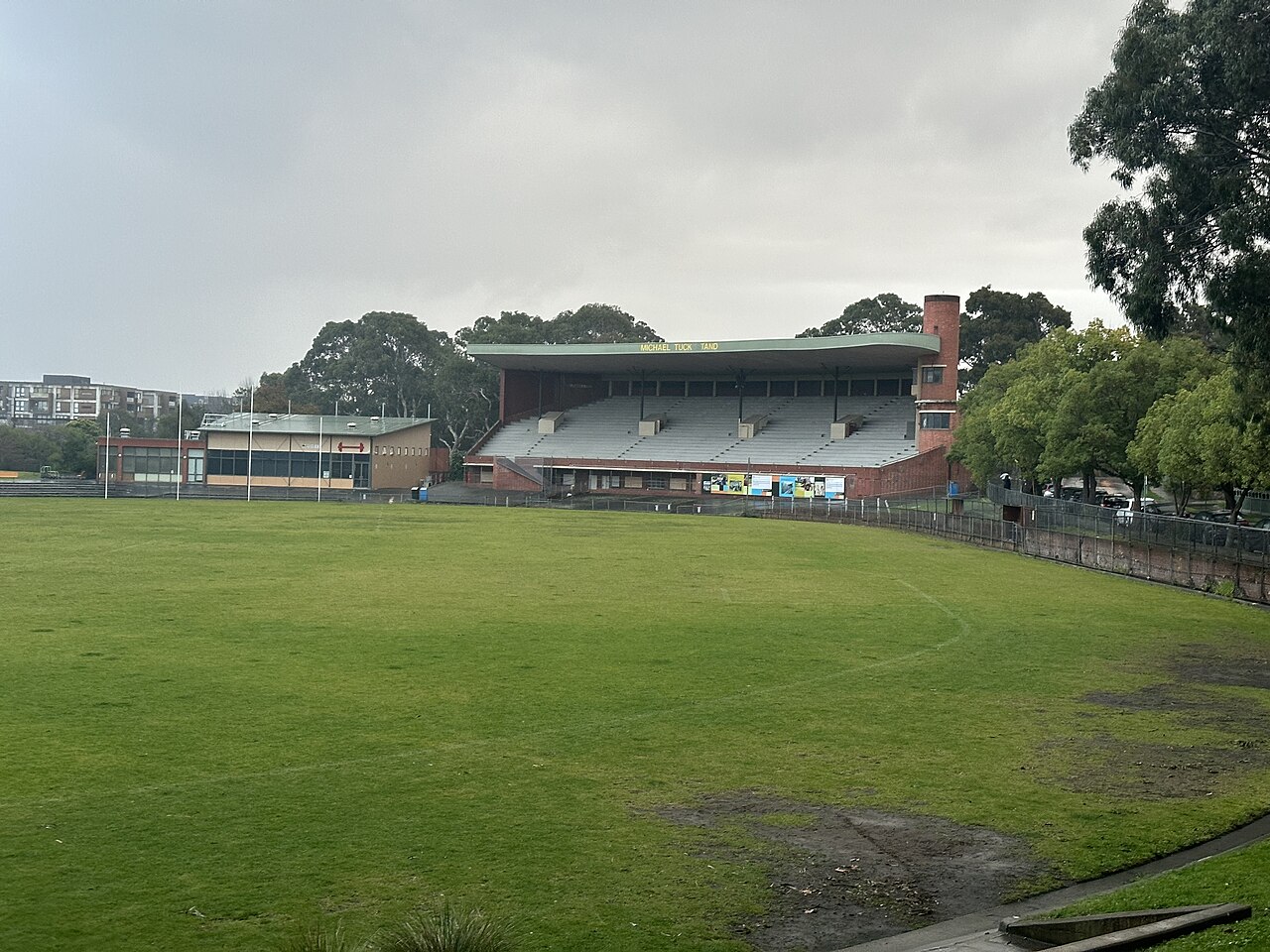 Grass playing field of Glenferrie Oval with the grandstand behind
