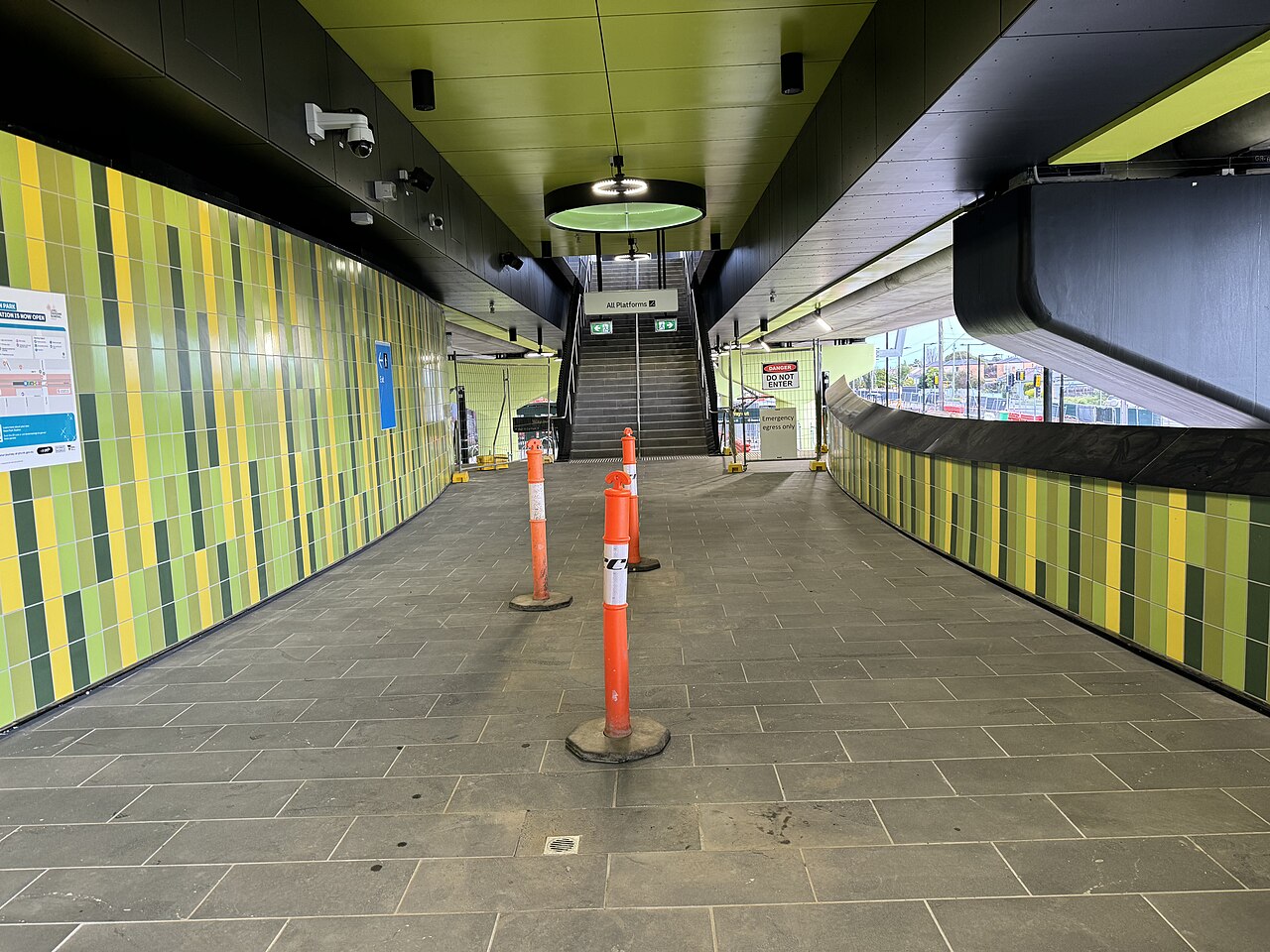 South stair interchange with green tiled walls at Keon Park station
