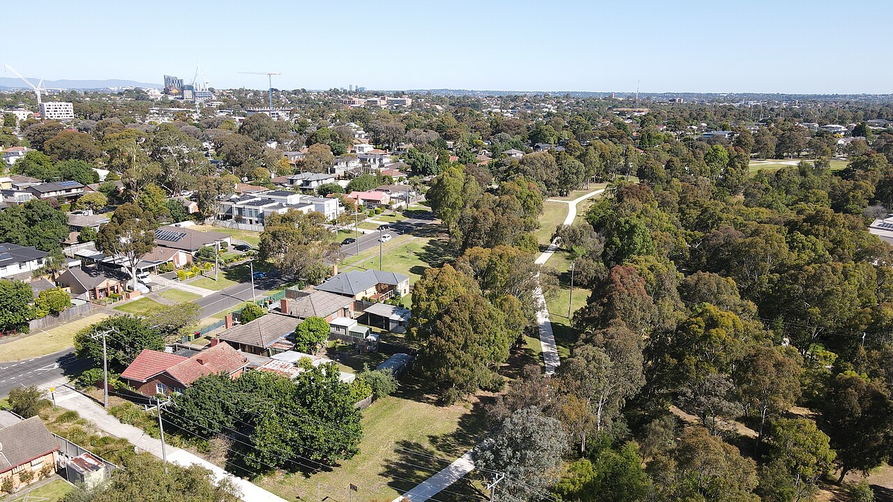 Aerial view looking south across West Heidelberg houses and parkland