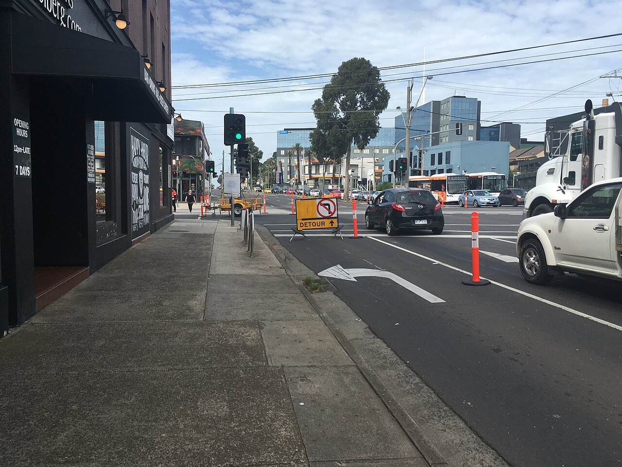 Plenty Road at Bell Street with shops and traffic during roadworks