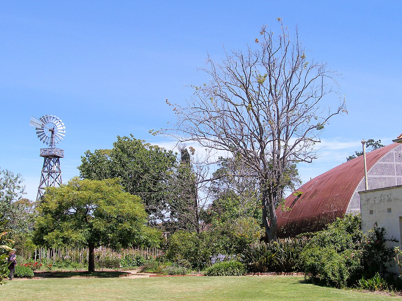 Rippon Lea back garden with windmill and conservatory