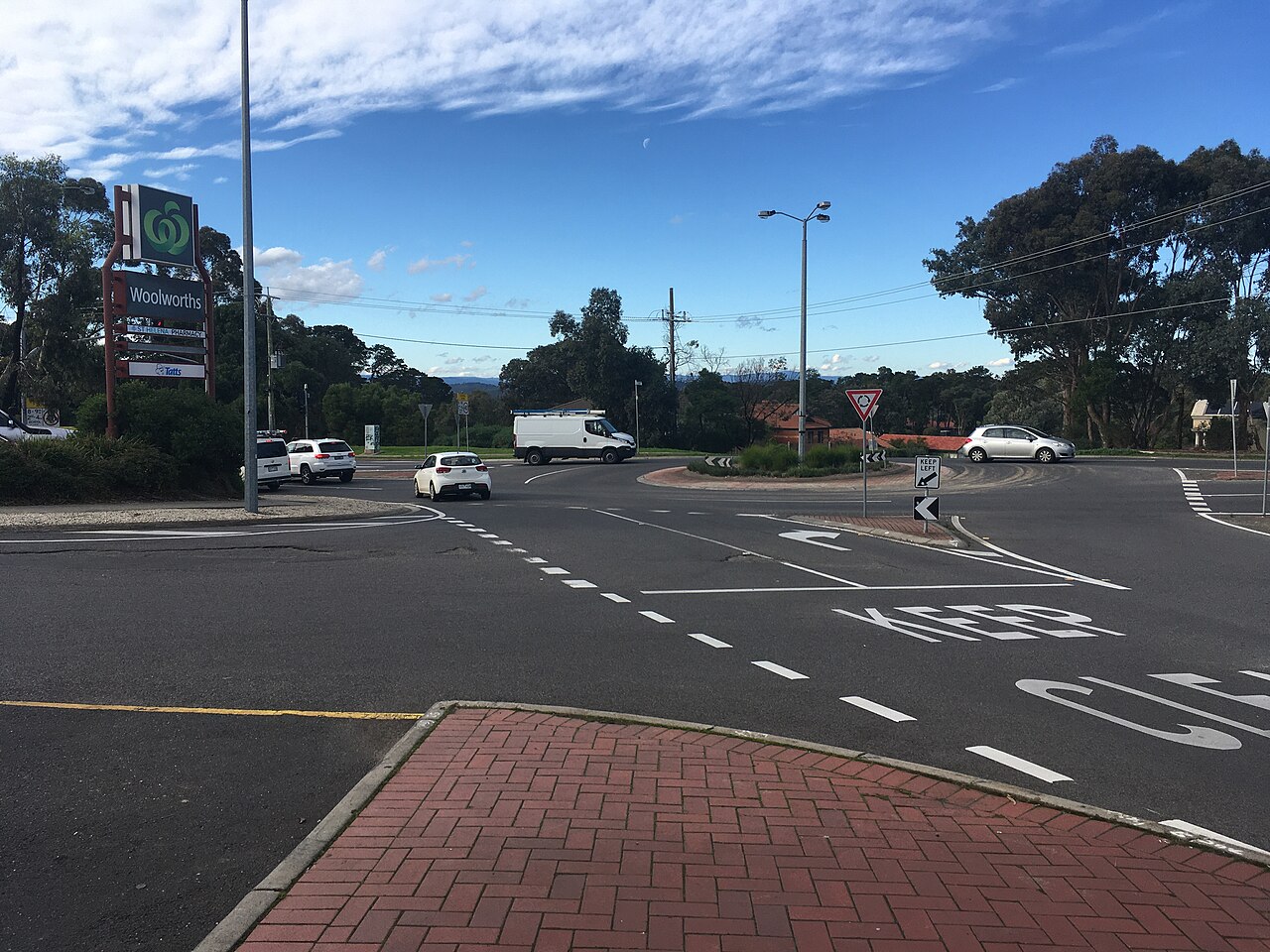 Road markings at a suburban roundabout intersection