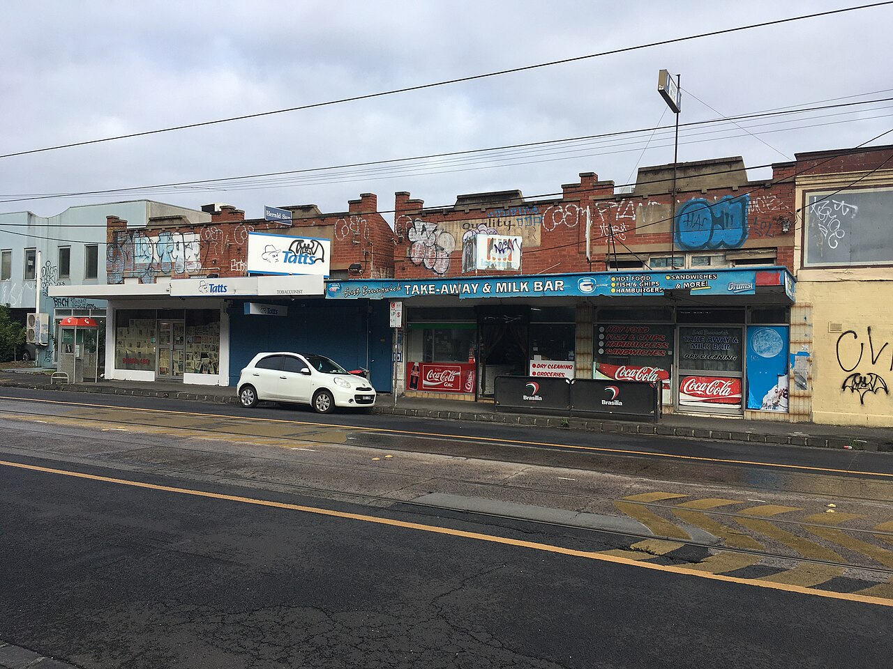Row of older shopfronts on Nicholson Street