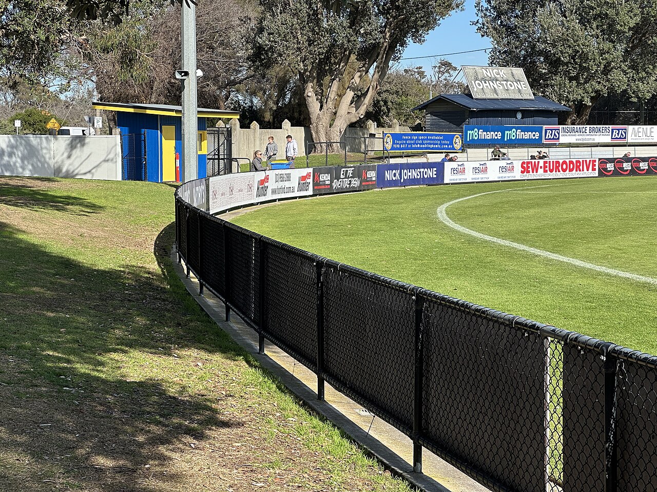 Grassed oval and fence at Trevor Barker Beach Oval