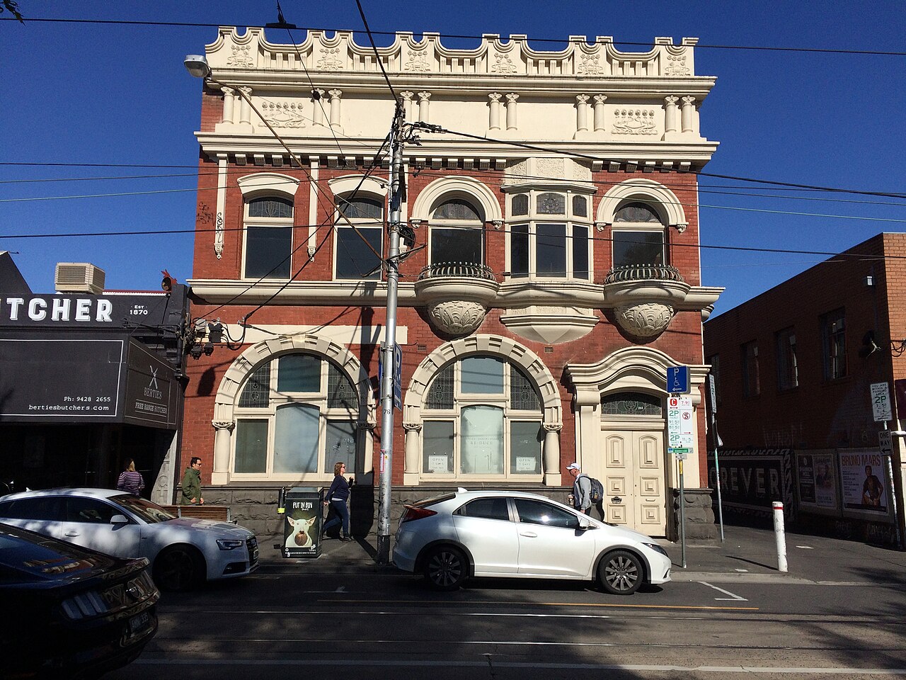 Ornate red brick State Savings Bank building on Swan Street