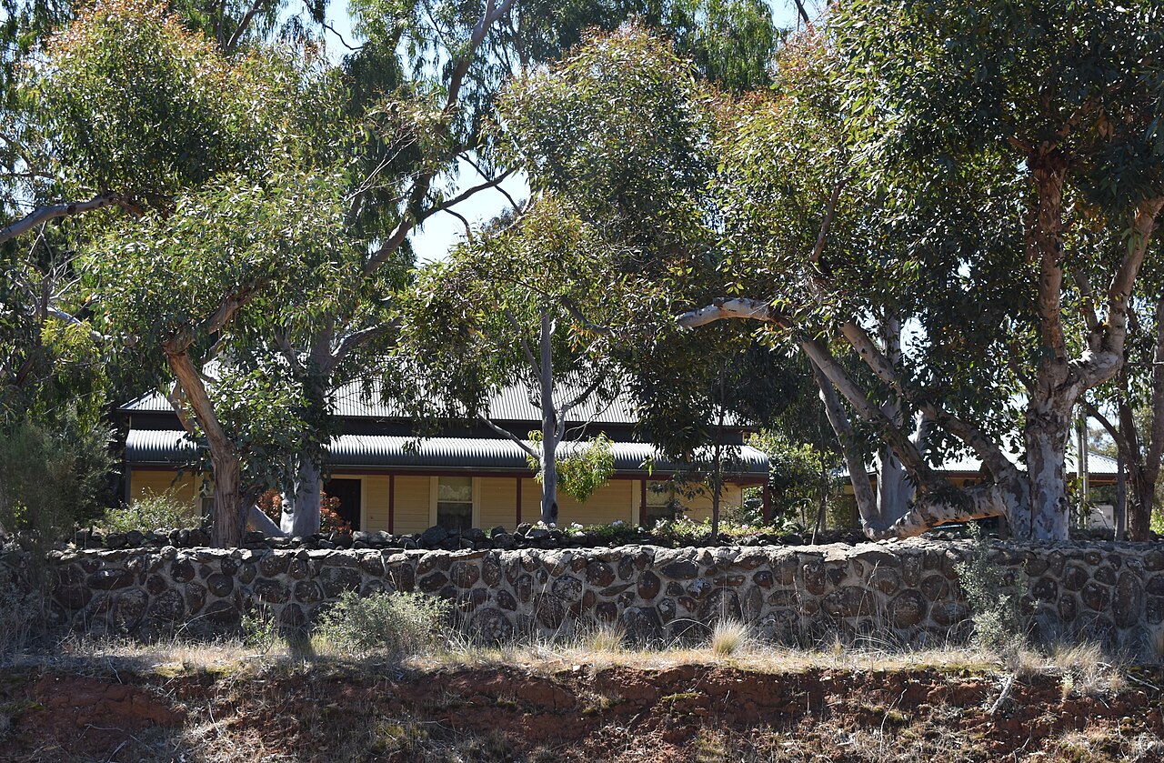 Strathtulloh Estate house behind a bluestone wall
