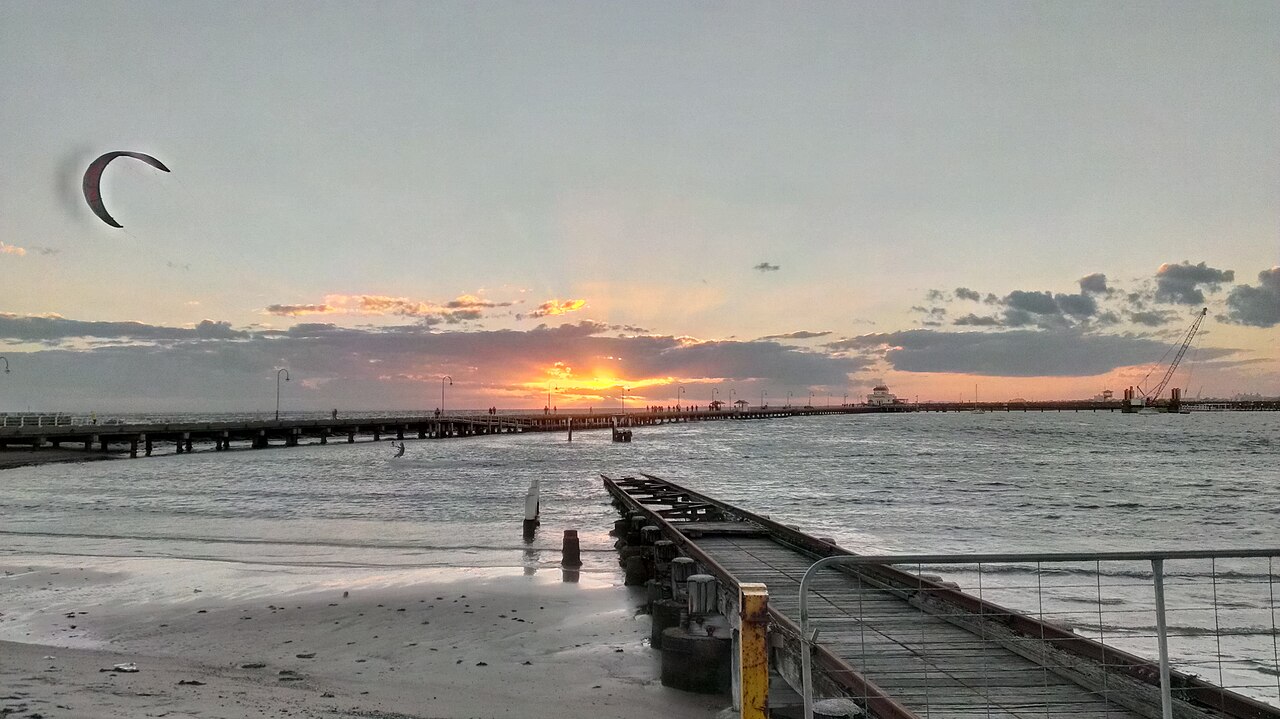 Pier stretching into the bay at sunset