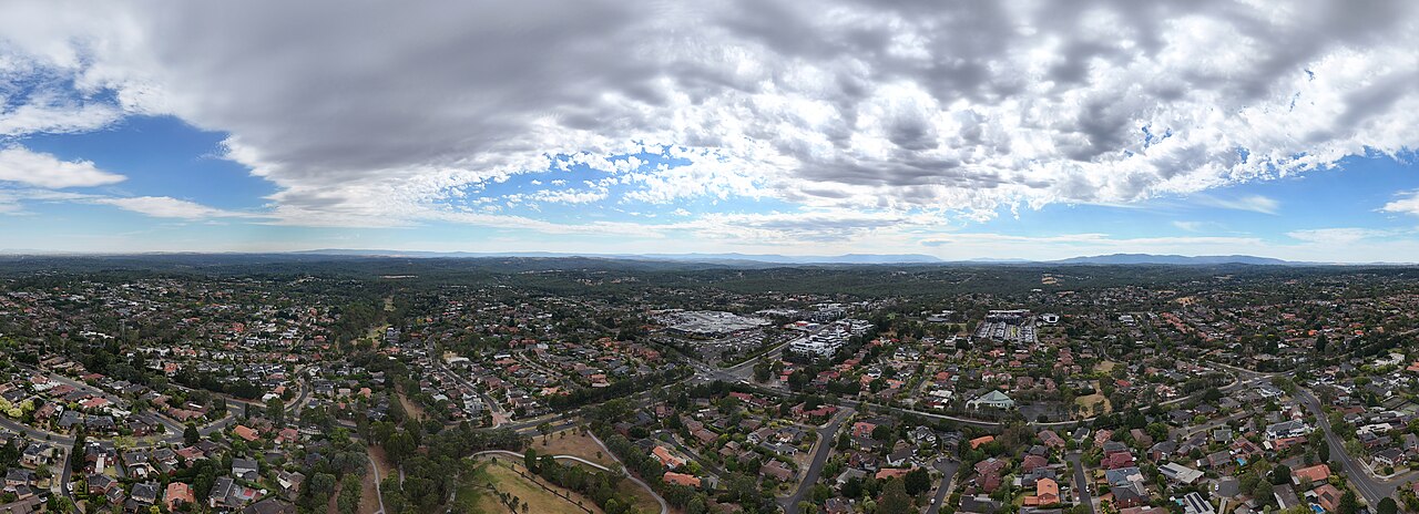 Aerial panorama over Templestowe under a cloudy sky