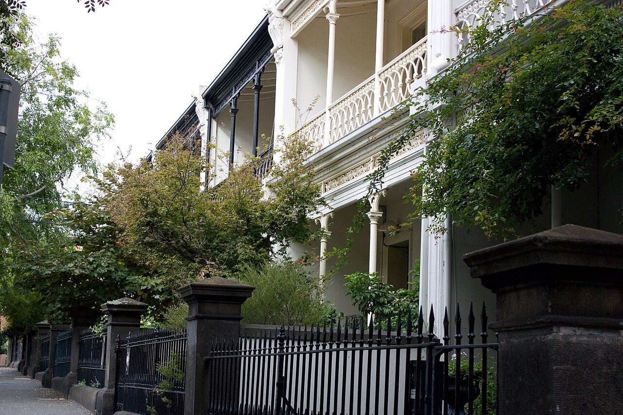 Terrace houses behind iron fences in East Melbourne