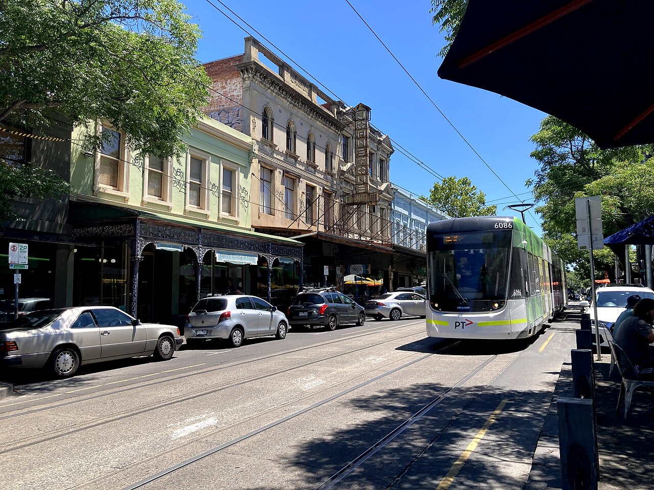 Tram on Gertrude Street with shopfronts