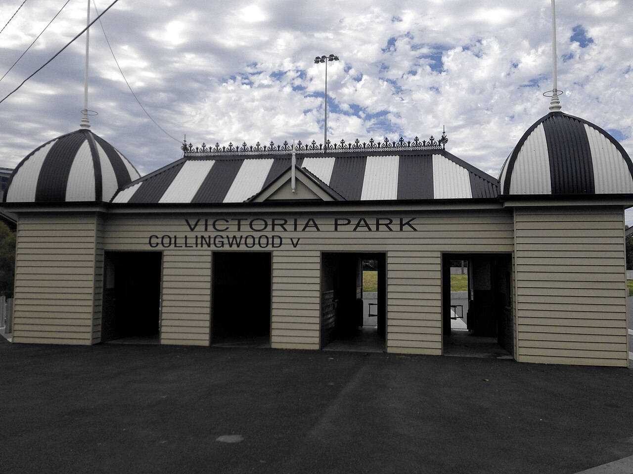 Striped heritage ticket booth gates at Victoria Park