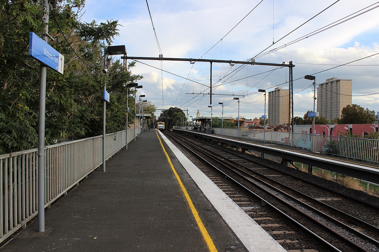 Platform at Victoria Park Station, Abbotsford, with tracks and overhead wires