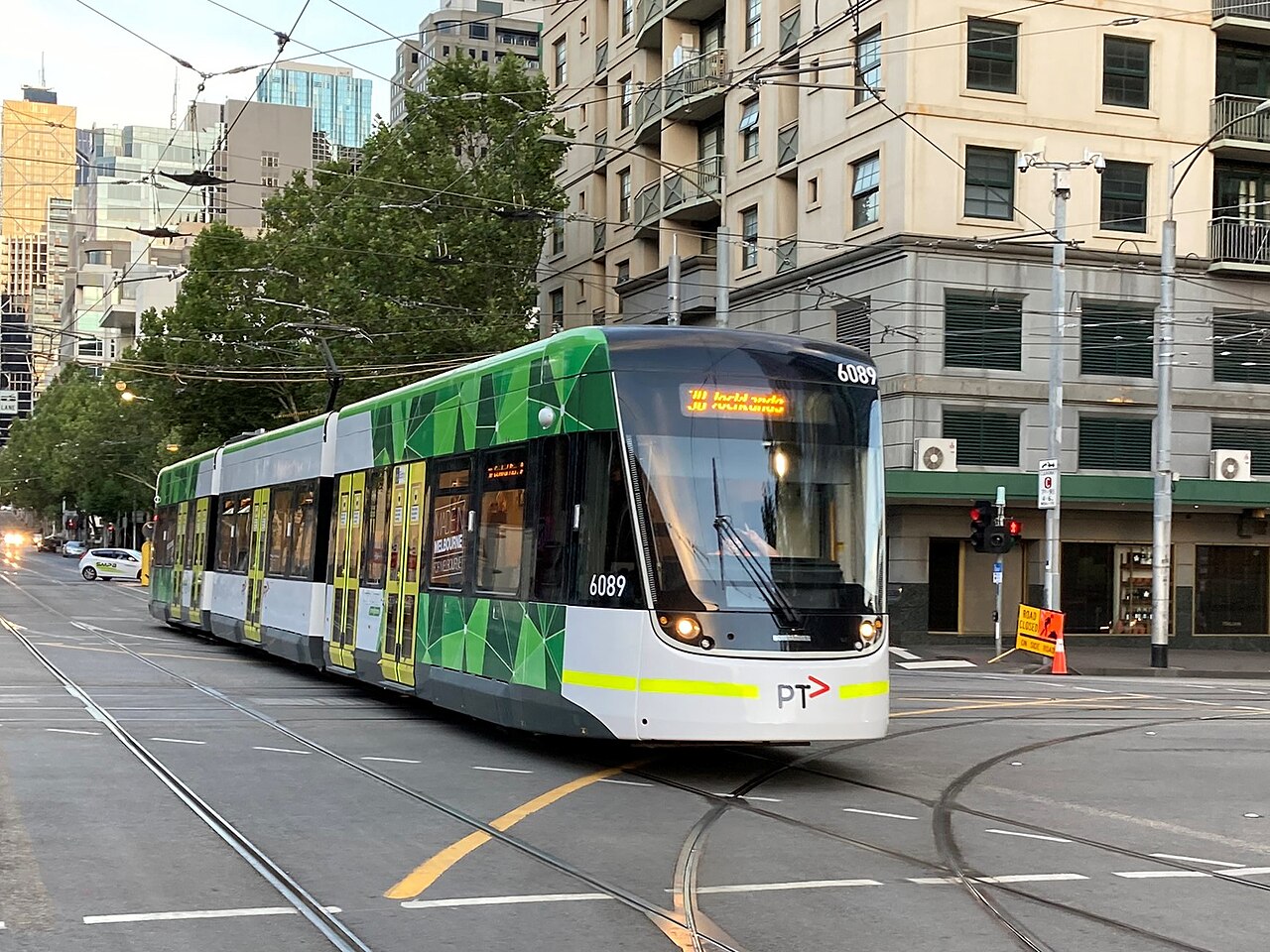 E-class tram on Route 30 at a city intersection