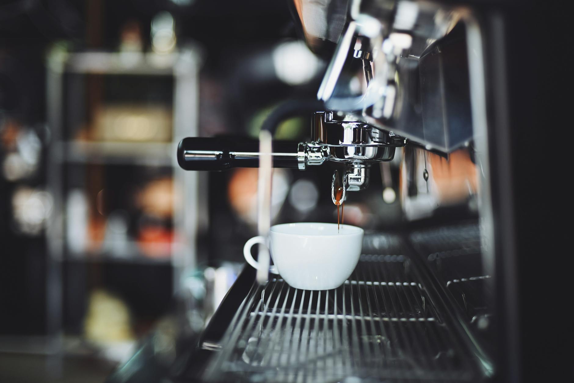 Flat white coffee being poured at a St Kilda cafe