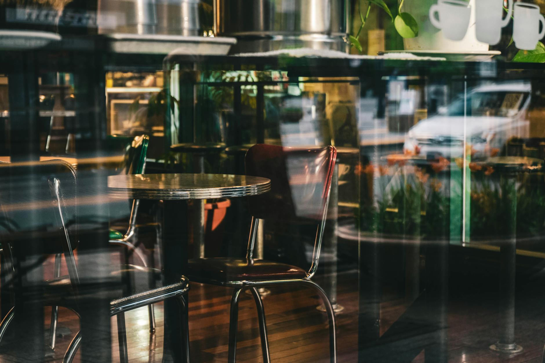 Morning cafe scene on Toorak Road with outdoor tables and tree-lined footpath