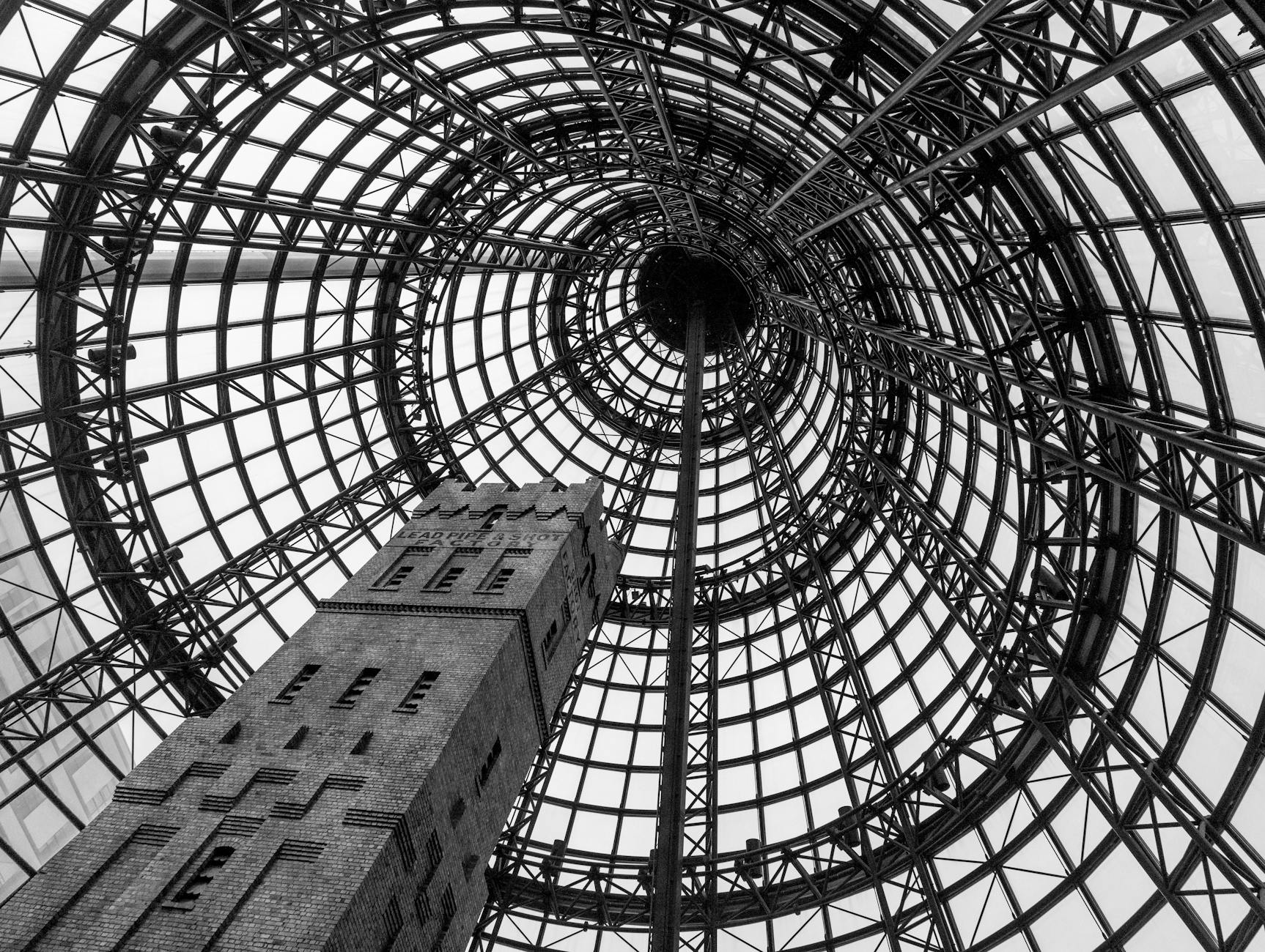 Quiet tree-lined residential street in Toorak with heritage mansions and manicured hedges